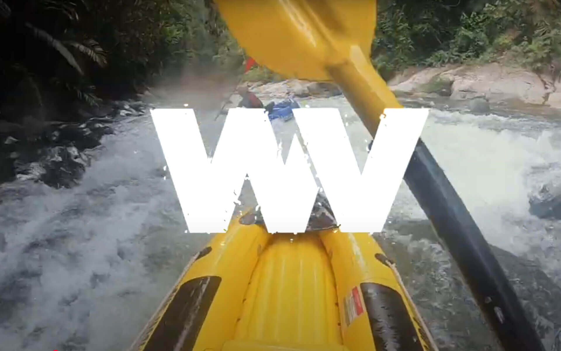A yellow kayak is being pushed through a river.